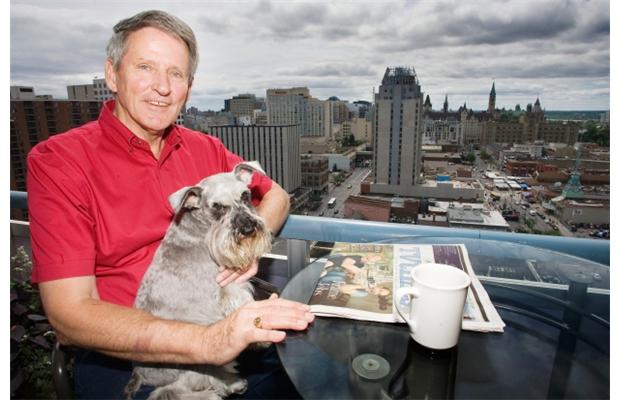 Gord Diamond and his dog, Clifford, enjoy the view from their balcony