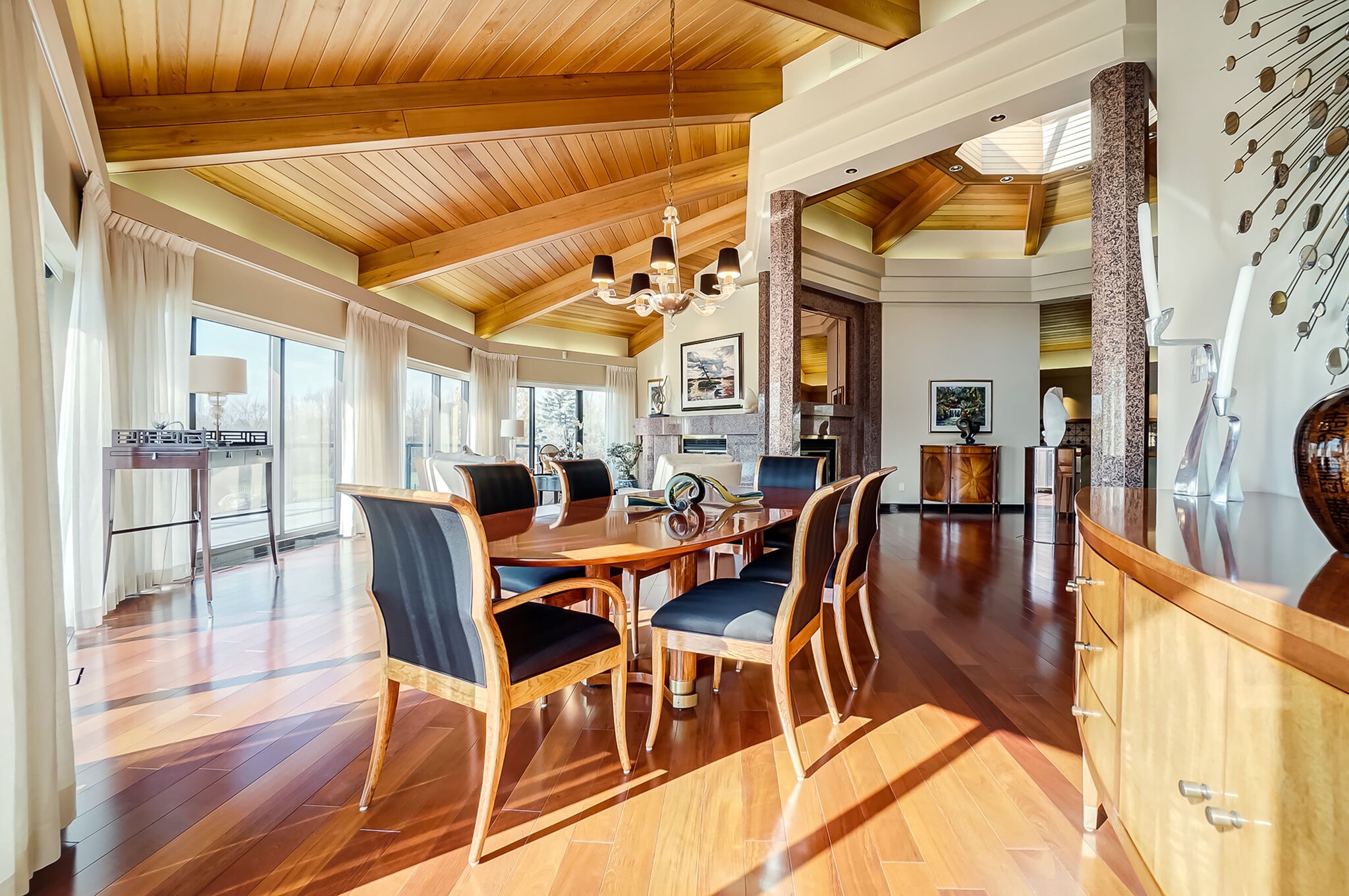 Walls of windows offer views of the Rideau River from three sides of the great room.