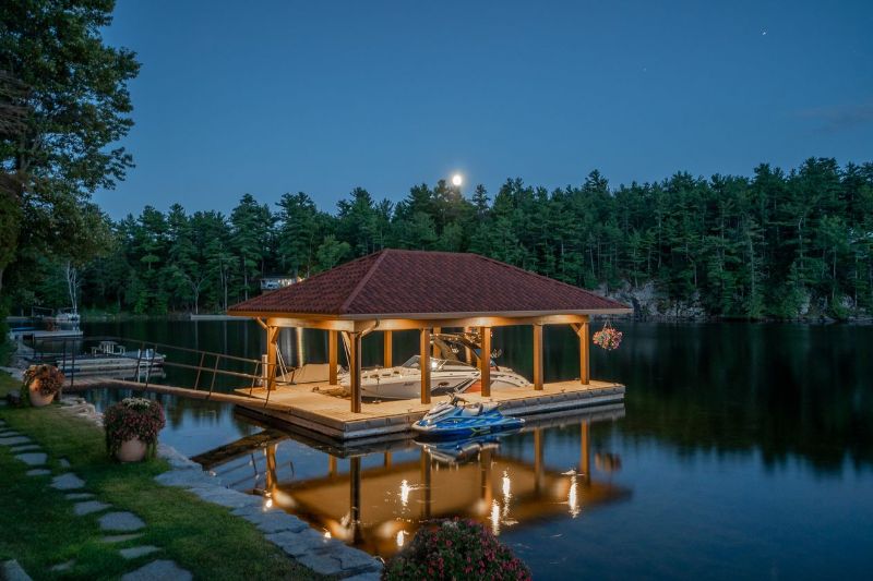 The estate includes a boathouse and a boat slip on Charleston Lake.